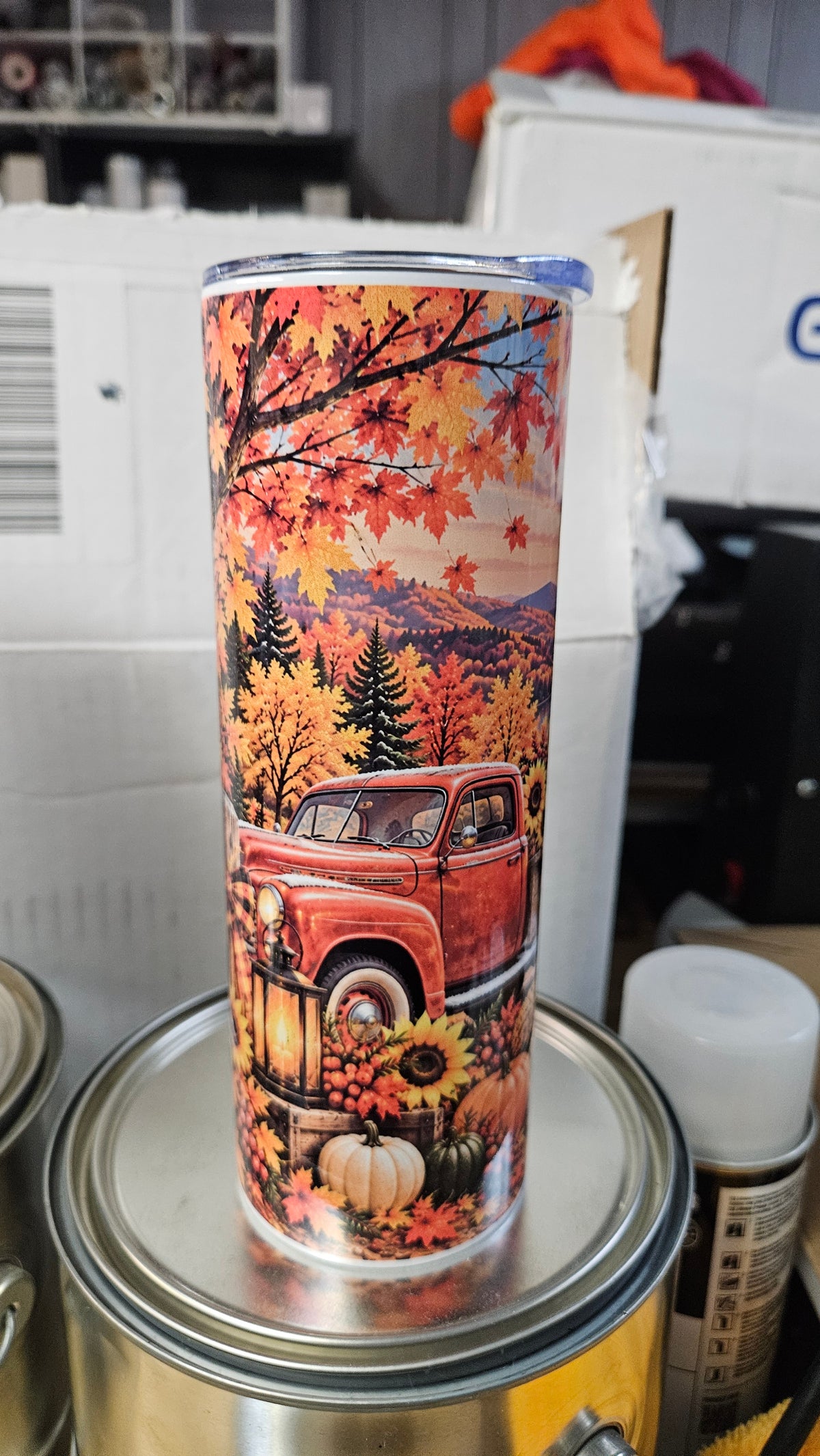 Autumn Harvest 20 oz tumbler with a red vintage truck, fall leaves, sunflowers and pumpkins